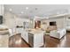Open concept living space featuring a modern kitchen, cozy living room, and stylish decor at 6936 White Willow Ct, Sarasota, FL 34243