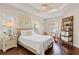 Serene main bedroom with a woven bed frame, ample natural light, and a tranquil ambiance at 6936 White Willow Ct, Sarasota, FL 34243