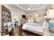 Bright main bedroom with ceiling fan, wood floors, and a walk-in closet at 6936 White Willow Ct, Sarasota, FL 34243