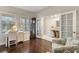 Bright office features hardwood flooring, neutral walls, large windows and French doors at 6936 White Willow Ct, Sarasota, FL 34243