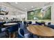 A bar area with seating and a mural of a golf ball at 72 Grande Fairway, Englewood, FL 34223