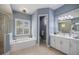 Bathroom featuring a shower, garden tub, double sinks, and private toilet room at 72 Grande Fairway, Englewood, FL 34223