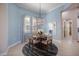 Charming breakfast nook featuring a round table, chandelier, and serene blue walls at 72 Grande Fairway, Englewood, FL 34223