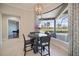 The breakfast nook provides great views, and access to the outdoor pool and screened in patio at 72 Grande Fairway, Englewood, FL 34223