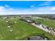 A scenic aerial view of the lush green golf course at 72 Grande Fairway, Englewood, FL 34223