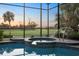 Relaxing hot tub surrounded by lush landscaping, with views of the golf course at 72 Grande Fairway, Englewood, FL 34223