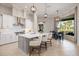 This kitchen offers a large island, stainless appliances, pendant lighting, and a breakfast nook at 72 Grande Fairway, Englewood, FL 34223