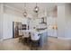 Beautiful kitchen with island, stainless steel appliances, pendant lighting, and ample counter space at 72 Grande Fairway, Englewood, FL 34223