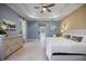 Spacious main bedroom with ensuite bathroom, soft lighting, and detailed trim at 72 Grande Fairway, Englewood, FL 34223