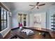 Bright office space with a large window, French doors, hardwood floors and ceiling fan at 72 Grande Fairway, Englewood, FL 34223