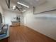 Large garage with wood floor, a ceiling fan, and overhead storage at 7602 Partridge Street Cir, Bradenton, FL 34202