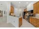Eat-in kitchen featuring wood cabinetry, stainless steel appliances, and granite countertops at 7602 Partridge Street Cir, Bradenton, FL 34202