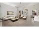 Bright and airy living room with stylish decor, tile flooring, and open access to the dining area at 7602 Partridge Street Cir, Bradenton, FL 34202