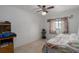 This is a bedroom with white walls, tan tile floors, and a closet at 8467 Imperial Cir, Palmetto, FL 34221