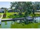 Picturesque waterfront property with a private dock, offering serene views and convenient lake access at 8467 Imperial Cir, Palmetto, FL 34221