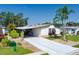 Charming single-story home with a covered carport and well-manicured lawn at 8467 Imperial Cir, Palmetto, FL 34221