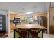 Bright kitchen showcasing a butcher block island, stainless steel appliances, and serene lake views at 8467 Imperial Cir, Palmetto, FL 34221