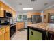 Well-equipped kitchen with stainless steel appliances, ample cabinet space, and a center island at 8467 Imperial Cir, Palmetto, FL 34221