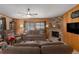 Cozy living room with a fireplace, comfortable seating, and warm lighting at 8467 Imperial Cir, Palmetto, FL 34221
