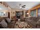 Spacious living area with plush seating, wood accents, and an open layout at 8467 Imperial Cir, Palmetto, FL 34221