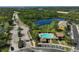 Aerial view of gated community with a pool, lake, and convenient parking at 8827 White Sage Loop, Lakewood Ranch, FL 34202
