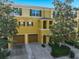 Charming townhome featuring multiple levels, two-car garage, and well-maintained landscaping at 8827 White Sage Loop, Lakewood Ranch, FL 34202