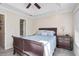 A bright main bedroom with a slider leading to a balcony and an ensuite bathroom at 8827 White Sage Loop, Lakewood Ranch, FL 34202