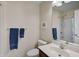 A tidy bathroom features a vanity and a bathtub/shower combination with classic fixtures at 8827 White Sage Loop, Lakewood Ranch, FL 34202