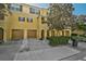 Attractive townhome with a two-car garage and well-manicured landscaping at 8827 White Sage Loop, Lakewood Ranch, FL 34202