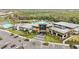 An impressive aerial view showcasing the community center amenities, including a pool and clubhouse at 9061 Luna Ln, Sarasota, FL 34241