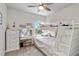 Bedroom featuring a bunk bed, vanity, and a bright window at 9061 Luna Ln, Sarasota, FL 34241