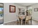 Cozy dining area with natural light, perfect for Gathering meals and entertaining guests at 9061 Luna Ln, Sarasota, FL 34241