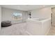Upstairs loft with gray carpet, a beanbag, and lots of light at 9061 Luna Ln, Sarasota, FL 34241