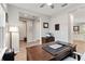 Well-lit office space with wood floors, large desk, and views to other rooms at 9061 Luna Ln, Sarasota, FL 34241