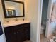Modern bathroom featuring a dark vanity with a bright countertop at 3724 71St E Ter, Sarasota, FL 34243