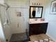 Modern bathroom featuring a dark vanity with a bright countertop at 3724 71St E Ter, Sarasota, FL 34243