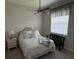 Cozy bedroom with natural light, neutral decor, and ceiling fan at 3724 71St E Ter, Sarasota, FL 34243