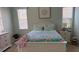 Cozy bedroom features white furnishings, natural light, and serene decor at 3724 71St E Ter, Sarasota, FL 34243