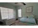 Cozy bedroom features white furnishings, natural light, and serene decor at 3724 71St E Ter, Sarasota, FL 34243