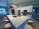 Bright modern kitchen featuring a large island with seating, stylish pendant lighting, and stainless steel appliances at 3724 71St E Ter, Sarasota, FL 34243