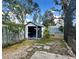 Backyard features a storage shed and gardening space at 1010 Gun Club Rd, Sarasota, FL 34232