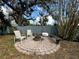 Backyard features a brick fire pit and seating area at 1010 Gun Club Rd, Sarasota, FL 34232