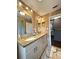This modern bathroom features a double sink vanity with granite countertop and decorative tiling at 1010 Gun Club Rd, Sarasota, FL 34232