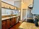 Kitchen area featuring granite countertops, stainless steel appliances, and wooden cabinetry at 1010 Gun Club Rd, Sarasota, FL 34232