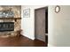 Living room stone fireplace and sliding barn door to an adjacent room at 1010 Gun Club Rd, Sarasota, FL 34232