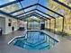 Large screened in pool and patio is perfect for entertaining or relaxing outdoors at 1010 Gun Club Rd, Sarasota, FL 34232