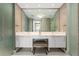 Elegant bathroom featuring a double vanity, large mirror, and modern fixtures, creating a spa-like experience at 1155 N Gulfstream Ave # 706, Sarasota, FL 34236