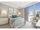 Bright bedroom with large window, neutral tones, and stylish decor at 1155 N Gulfstream Ave # 706, Sarasota, FL 34236