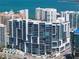Exterior of a modern high-rise condominium building offering stunning city and ocean views at 1155 N Gulfstream Ave # 706, Sarasota, FL 34236