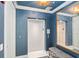Elevator lobby with blue textured walls, mirror, and patterned bench at 1155 N Gulfstream Ave # 706, Sarasota, FL 34236